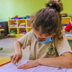 Kampala International School Key stage 1 girl writing